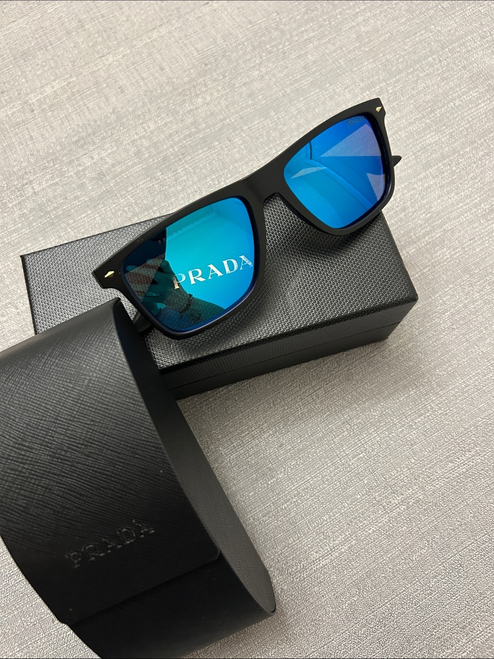 Prada Men's Black Frames with Blue Mirrored Lenses